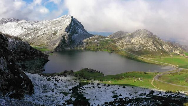Lakes of Covadonga in Asturias with snowy mountains