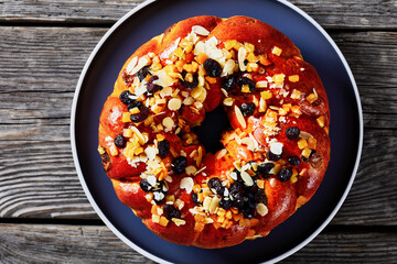sweet bread wreath sprinkled with fruits and nuts
