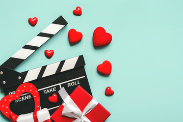 Happy Valentine's Day. Clapperboard with red hearts,Valentine's gifts box and copy space. Romantic...