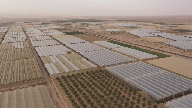 Aerial view of organized complex of greenhouses and rural fields in Paran 'moshav'. Drip technology and other innovative farming methods in the Negev desert, Israel. 
