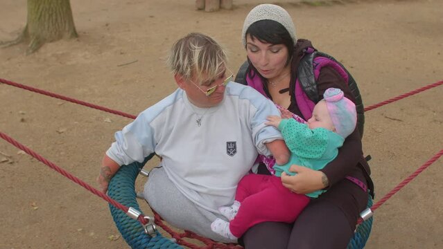 A Disabled Woman Together With A Mother And A Child. To Maintain Friendly Relations With His Neighbors.