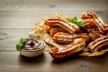 Spanish churros waffles on baking paper, top view