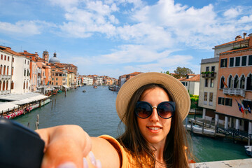 Travel influencers Venice island. Paint building house in Europe Venezia city. Photographer blogger...