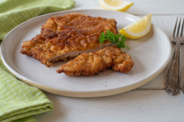 Fresh fried schnitzel on a white plate
