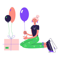 happy woman prepares a gift with balloons