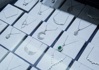 Diamond necklaces in a jewelery display. diamond jewelery
