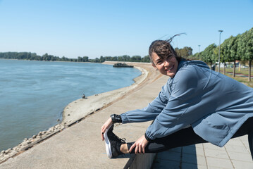 Young active sporty business woman morning routine of exercising outdoor before she go to the work at office. Self loved female workout training for health life.