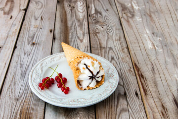 Ice cream sundae on grey wooden background.