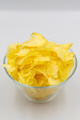 Potato chips or Crispy in a bowl on white background. Close up