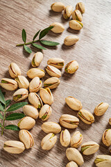 Pistachios on the wooden background