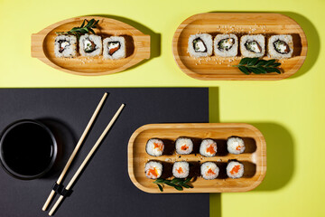 Fish food - sushi, on a bright colored background.