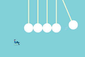 Momentum energy concept, Impulse for action and moving forward with goals metaphor. Symbolic motivation push impact and inner drive for success. Businessman in deep thinking and looking at Cradle