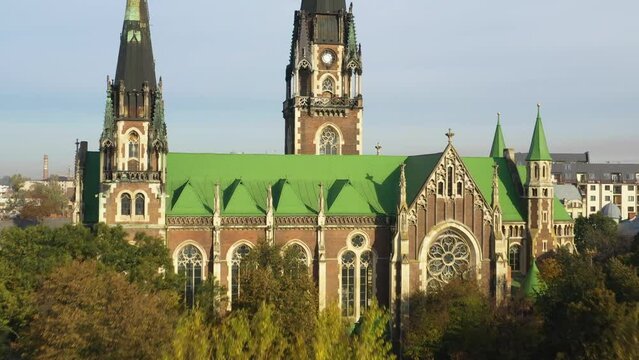Aerial view of historical Church of Saints Olga and Elizabeth old gothic temple in town Lviv, Ukraine. Flying by drone over dome. 4k footage of landmarks, architecture of european Lviv city