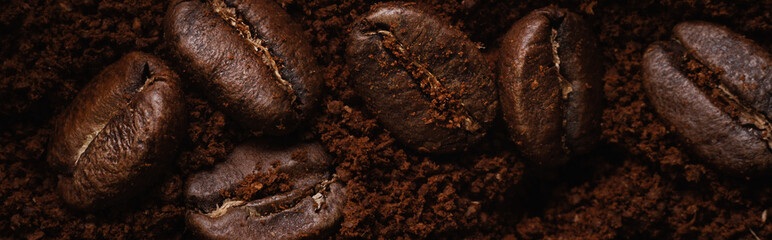 Macrophotography of coffee beans lie on textured wood and burlap. Fresh harvest aromatic coffee. Selective focusing. Back for cafe, restaurant or coffee shop. advertising banner