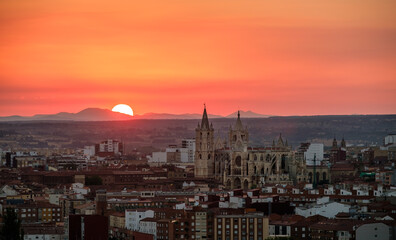 Fototapeta na wymiar Leon Cathedral sunset Castilla Leon, Gothic architecture Spain sun drawing the silhouette towers
