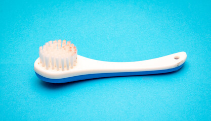 Cleaning brush on blue