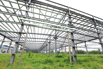The steel beam framework of the plant is in the weeds
