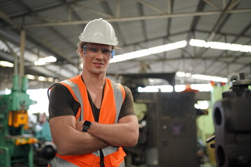 Industrial Engineers in Hard Hats.Work at the Heavy Industry Manufacturing Factory.industrial worker indoors in factory. man working in an industrial factory.