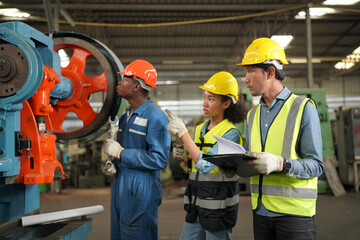 Industrial Engineers in Hard Hats.Work at the Heavy Industry Manufacturing Factory.industrial worker indoors in factory. man working in an industrial factory.