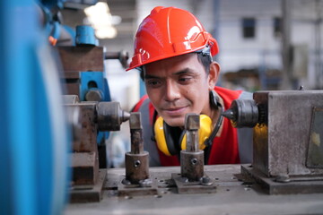 Industrial Engineers in Hard Hats.Work at the Heavy Industry Manufacturing Factory.industrial worker indoors in factory. man working in an industrial factory.