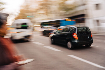 Blurred cars driving on road
