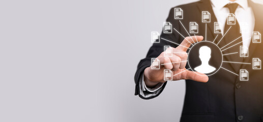 Document Management System DMS .Businessman hold user and document icon.Software for archiving,...