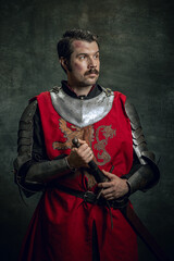 Vintage style portrait of brutal seriuos man, medieval warrior or knight with dirty wounded face...