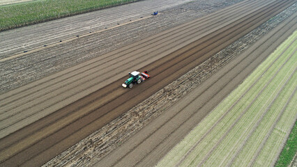Fototapeta premium farmers sow winter wheat in fields, North China