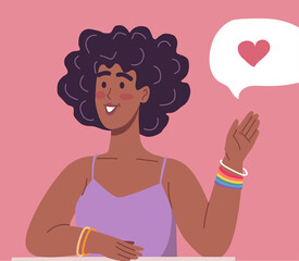 Beautiful young woman with a friendly bracelet for LGBT people sends greetings and love to all