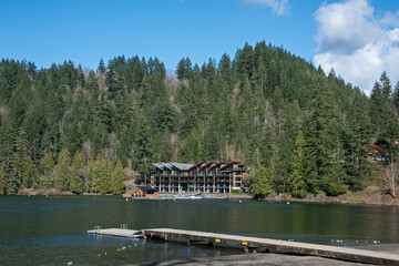 Lake overview with small panton pier and water front resort building