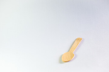 A picture of a wooden spoon in a white background