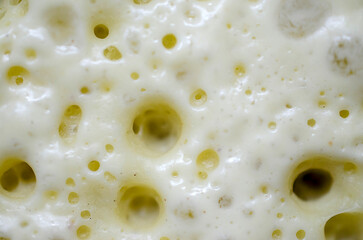 Close-up view of crepes dough, pancakes during the cooking process