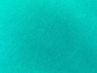 Dark green old velvet fabric texture used as background. Empty green fabric background of soft and smooth textile material. There is space for text...