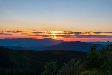 Fototapeta na wymiar Sunset from Dlouhe strane hill in Jeseniky mountains in Czech republic