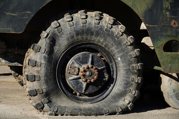 Fototapeta na wymiar A flat tire on a voyengoy vehicle. Military padded armored personnel carrier. Military Conflict.