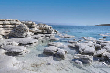 View of the beautiful patterns of the salt formations of the Dead Sea. Salt mushrooms