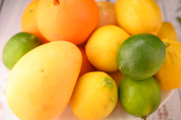 Plate with differents citrus and mangos macro