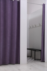 Empty dressing room in fashion store. Stylish interior