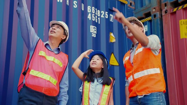 Grandfather took his son and grandchildren to see own business family at container site. Business support logistics cargo freight ship transportation, transport - importing goods internationally.