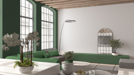 Modern kitchen and living room in vintage apartment in beige and green tones with windows, flowers close up, depth of fields, sofa. Classic parquet, wooden roof beams, interior design