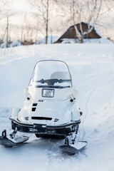 Snowmobile in winter conditions. Snowmobiling in winter in the north. Extreme kind of winter outdoor sport.