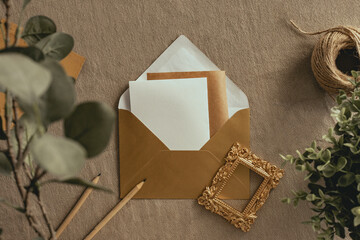 Rustic wedding invitation in golden color