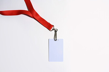 Red lanyard with blank badge isolated on white background