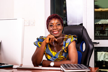 beautiful adult business woman smiling in office