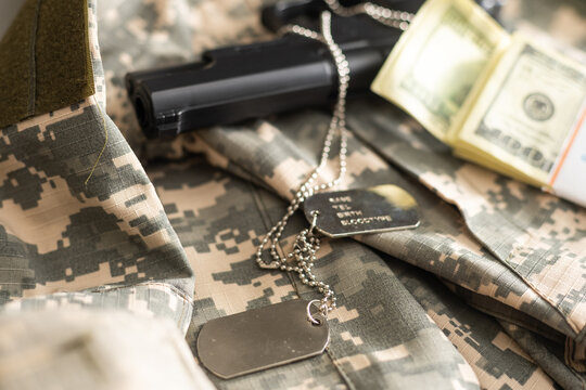 gun with dogtags. Concept of duty and service in US army forces. Veteran concept
