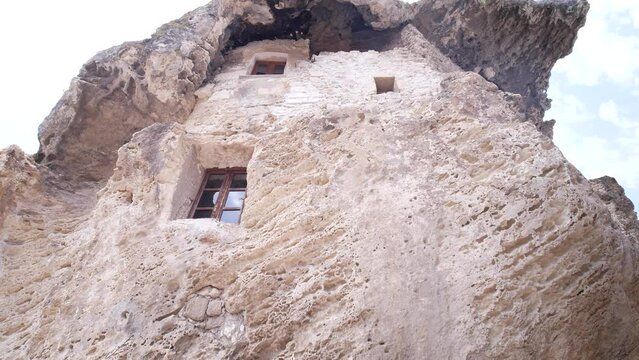 Sedini, Sassari, Italy, Europe - July 2 2021: Domus de Janas, the house in the rock or house of fairies, an extraordinary example of pre-Nuragic architecture in the Anglona region in Sardinia.