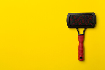 Pet brush on color background