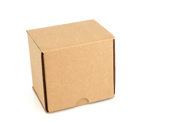Cardboard box container brown cube shape with lid closed on white background. Recycling, e commerce, reusable, design element. Copy space.