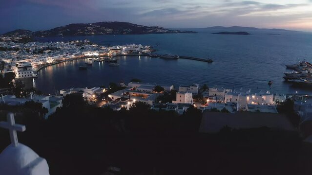 Beautiful Greece tourist landscape. Mykonos island harbor in twilight panorama