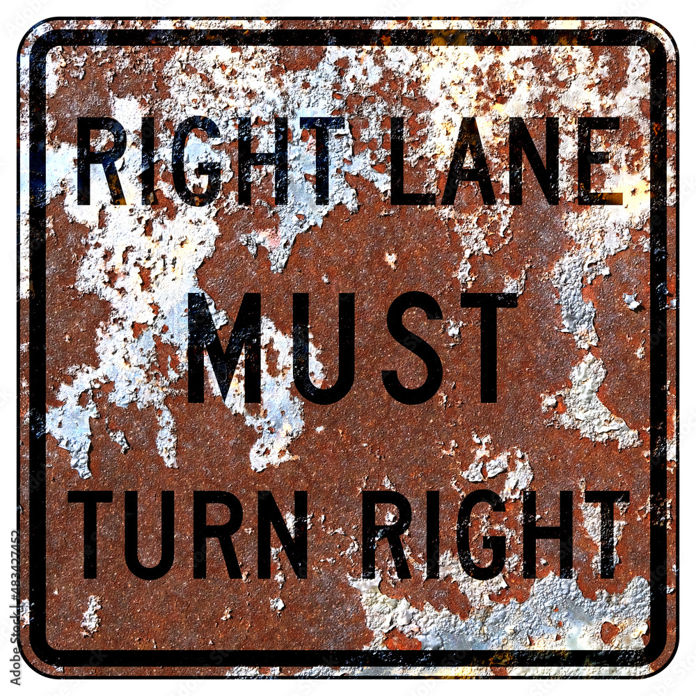 Wall mural Old rusty American road sign - Right lane MUST turn right sign